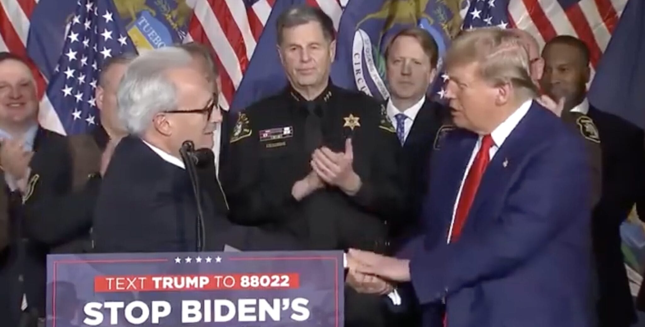 POAM President Jim Tignanelli shaking hands with Donald Trump